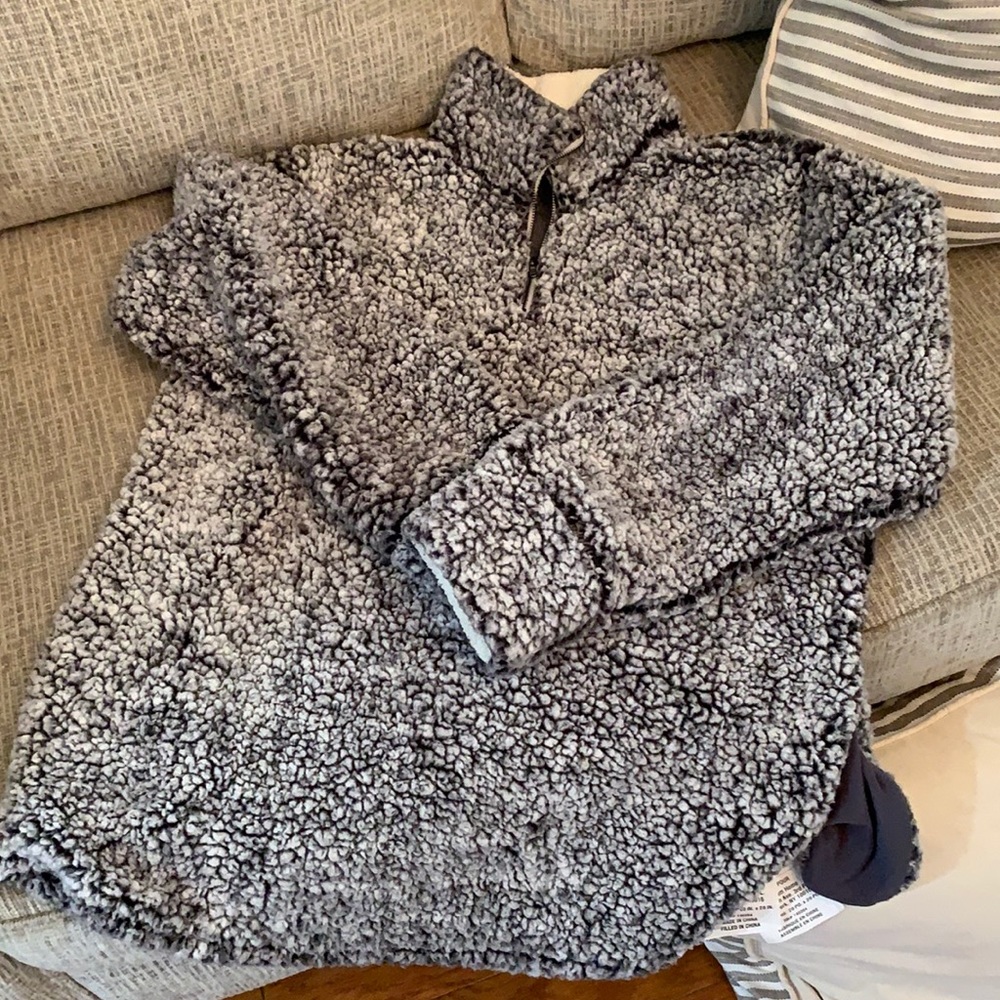 A grey and white fluffy winter jacket